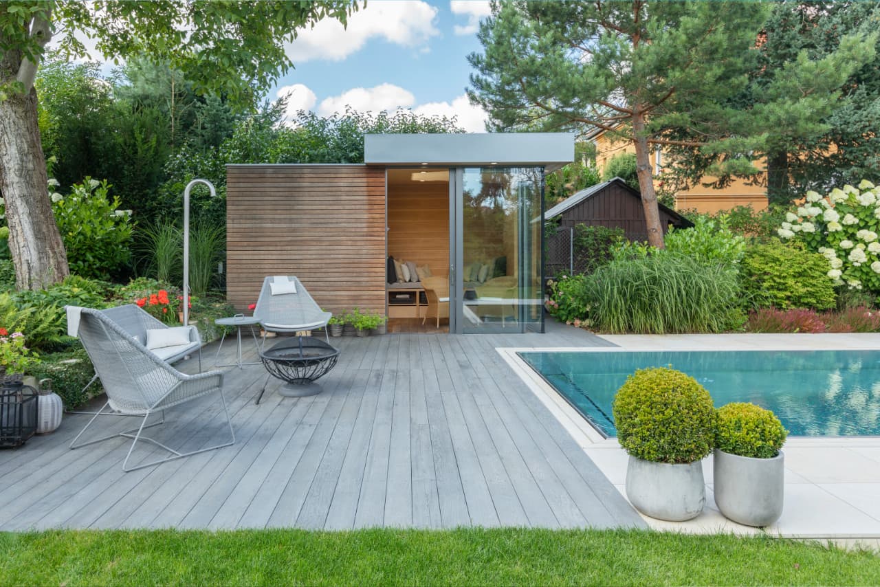 Stainless steel pool and outdoor sauna in the garden