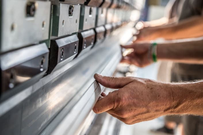 Press brake for manufacturing stainless steel pools