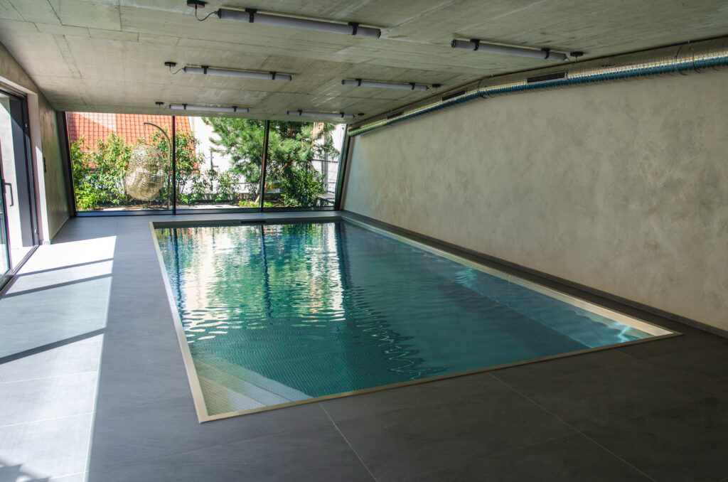Luxury stainless steel pool IMAGINOX with a corner staircase