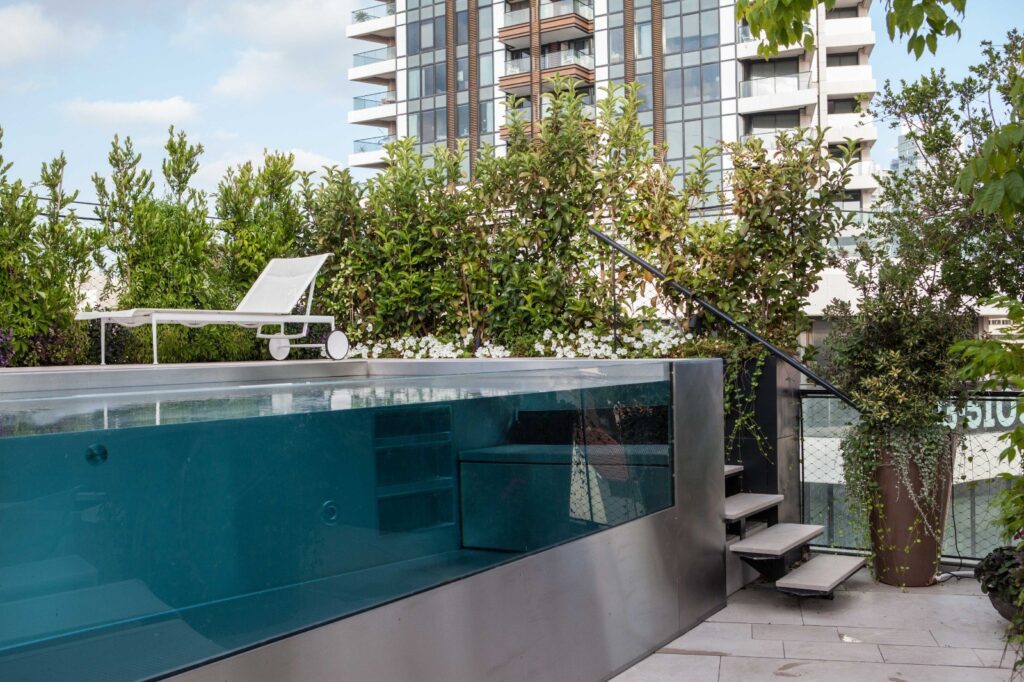 Stainless steel pool with glass walls